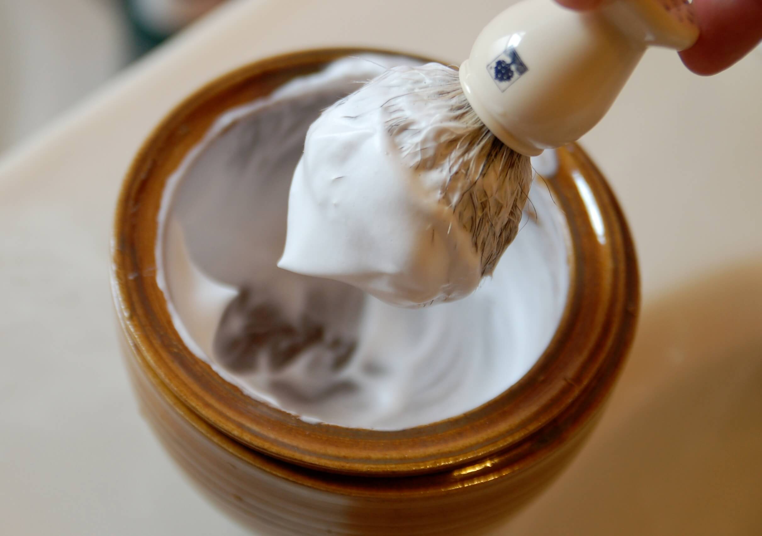 badger brush to apply the shaving cream